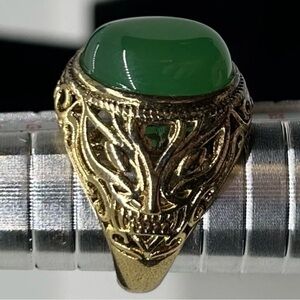 Vintage Gold-Tone Ring with Green Oval Cabochon Stone Ornate Filigree Design